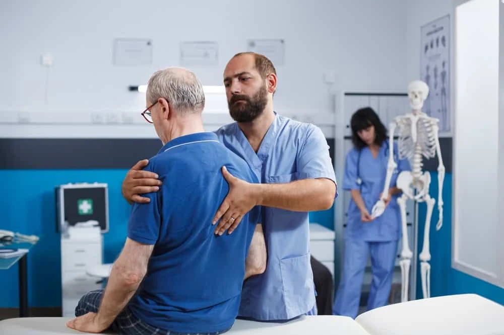 A patient undergoing spinal cord stimulation treatment in NYC with integrated physiotherapy, showcasing a multidisciplinary approach to managing chronic pain and improving physical function.