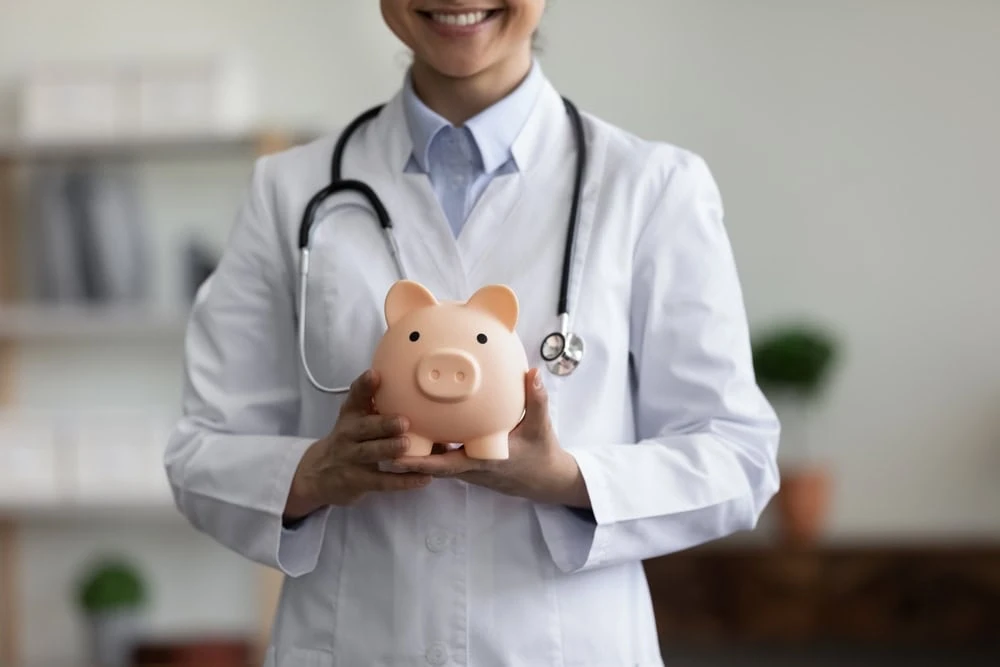 A professional doctor in NYC standing in a clinical or hospital setting, representing expert medical care and patient-focused treatment in New York City.