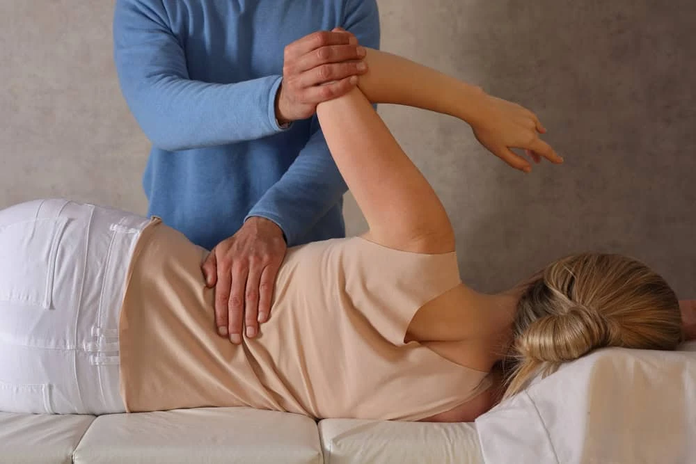 A patient in NYC receiving physiotherapy support as part of spinal cord stimulation treatment, guided by pain specialists to manage chronic nerve and back pain.