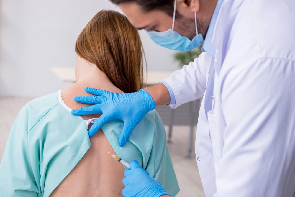 A doctor from NY Spine Medicine’s expert team in NYC administering a spinal injection to a patient, providing targeted pain relief for chronic back or nerve-related conditions.
