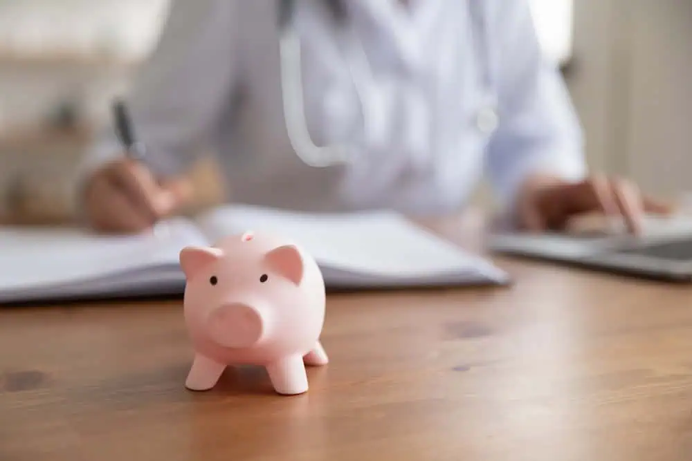 A workers' compensation doctor in NYC evaluating an injured patient, focusing on accurate diagnosis, treatment, and documentation for workplace injury claims.