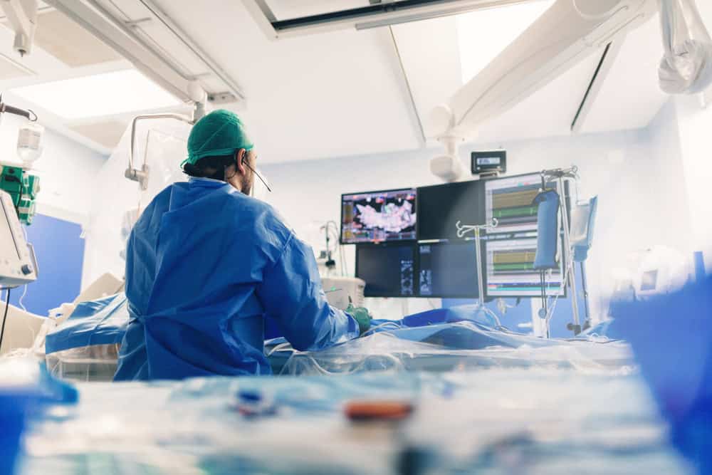 A pain management specialist in NYC performing radiofrequency ablation treatment on a patient, using image-guided technology to deliver targeted nerve pain relief.