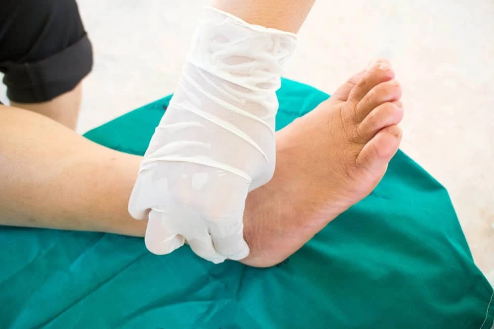 A neuropathy doctor in NYC working with a patient during a physiotherapy session, offering holistic solutions for nerve pain relief through medical care and rehabilitative therapy.
