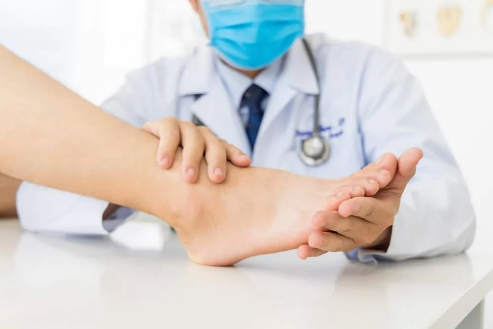 A neuropathy doctor at NY Spine Medicine in NYC examining a patient during a physical assessment, offering advanced treatment options including physiotherapy, diagnostics, and interventional care for nerve pain relief.