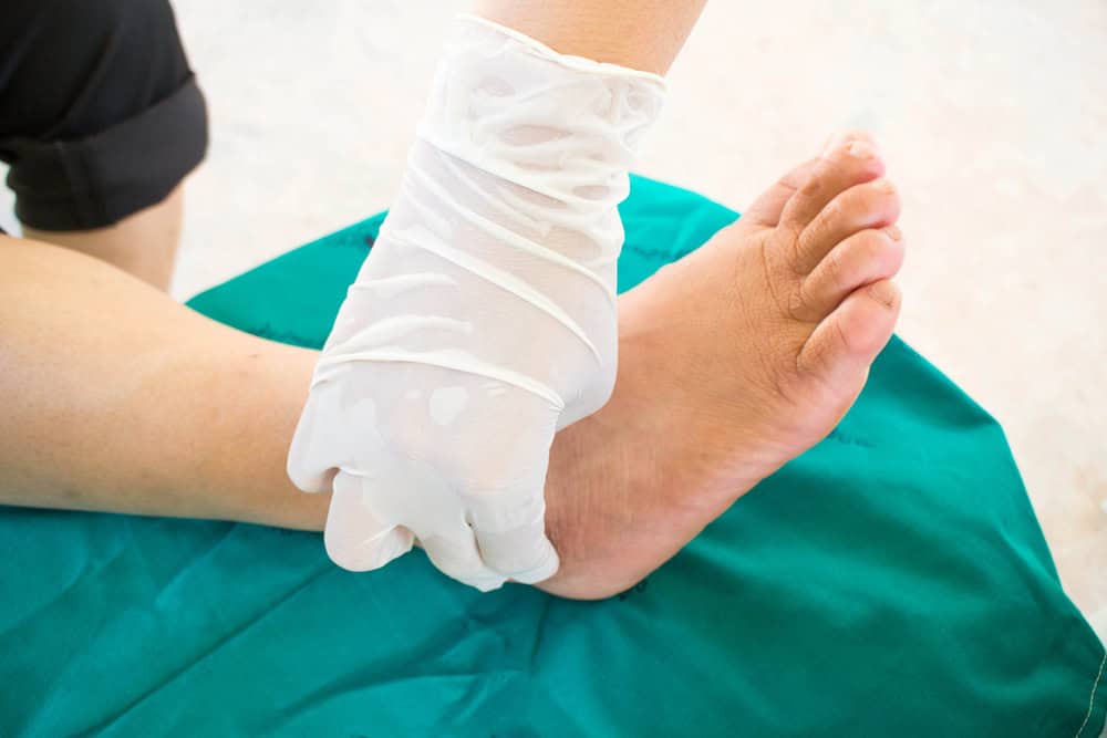A neuropathy doctor in NYC working with a patient during a physiotherapy session, offering holistic solutions for nerve pain relief through medical care and rehabilitative therapy.
